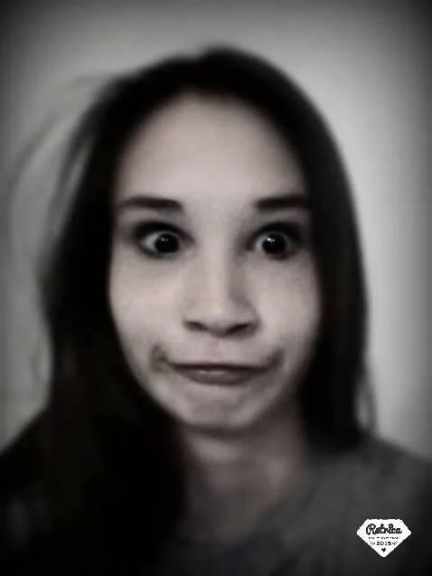 A bird sitting on a nest of eggs.