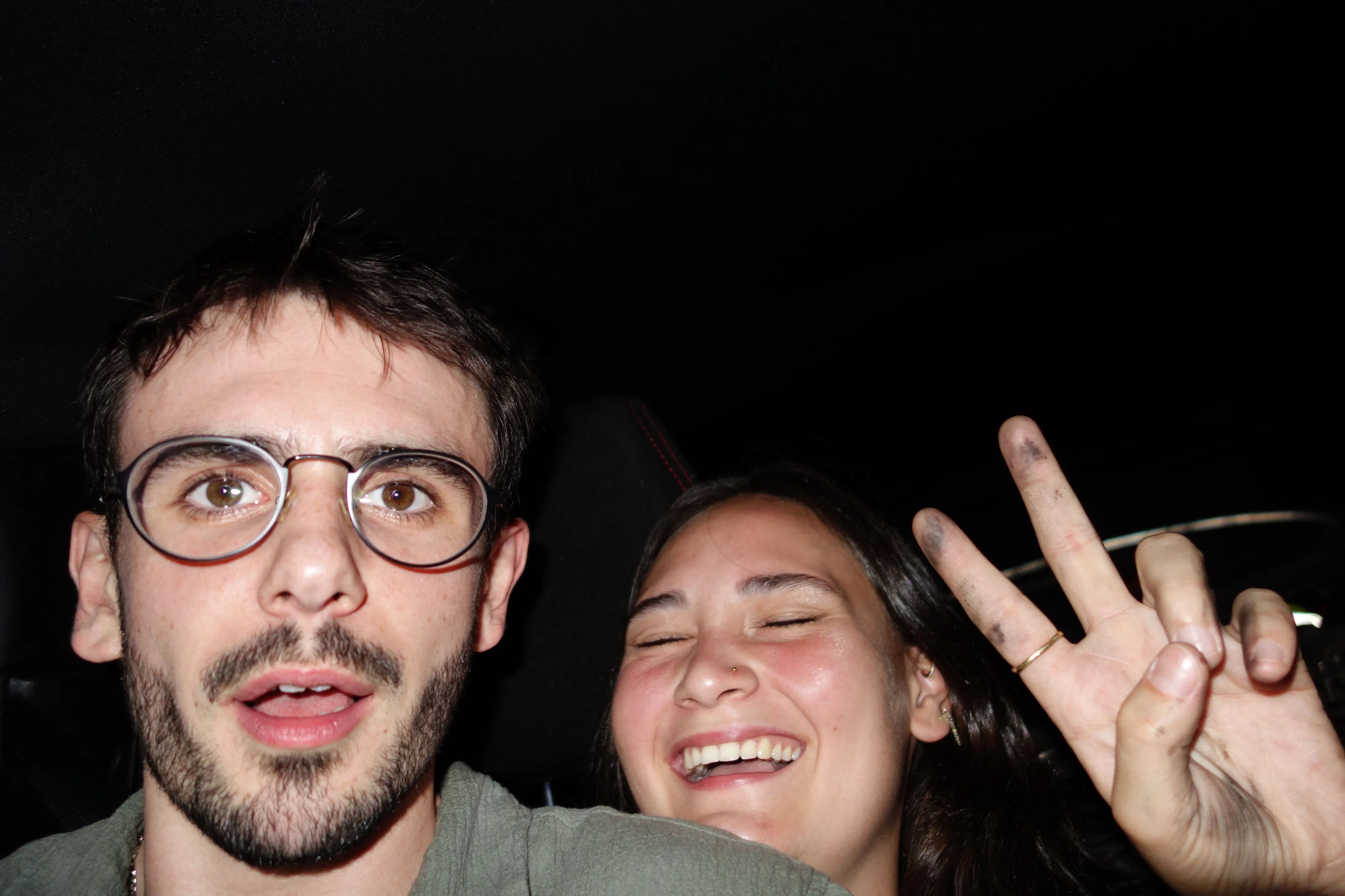 A bird sitting on a nest of eggs.