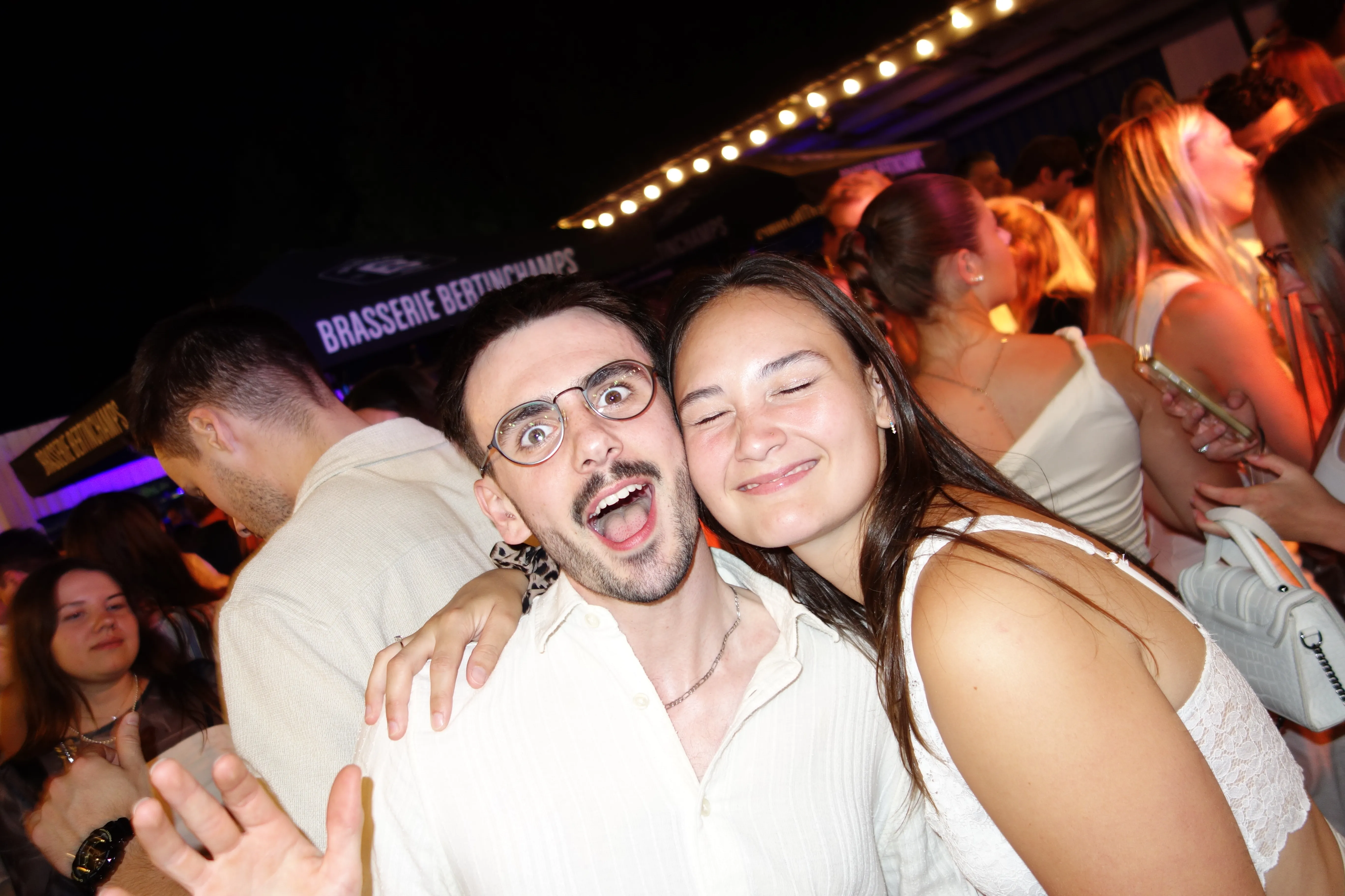 A bird sitting on a nest of eggs.