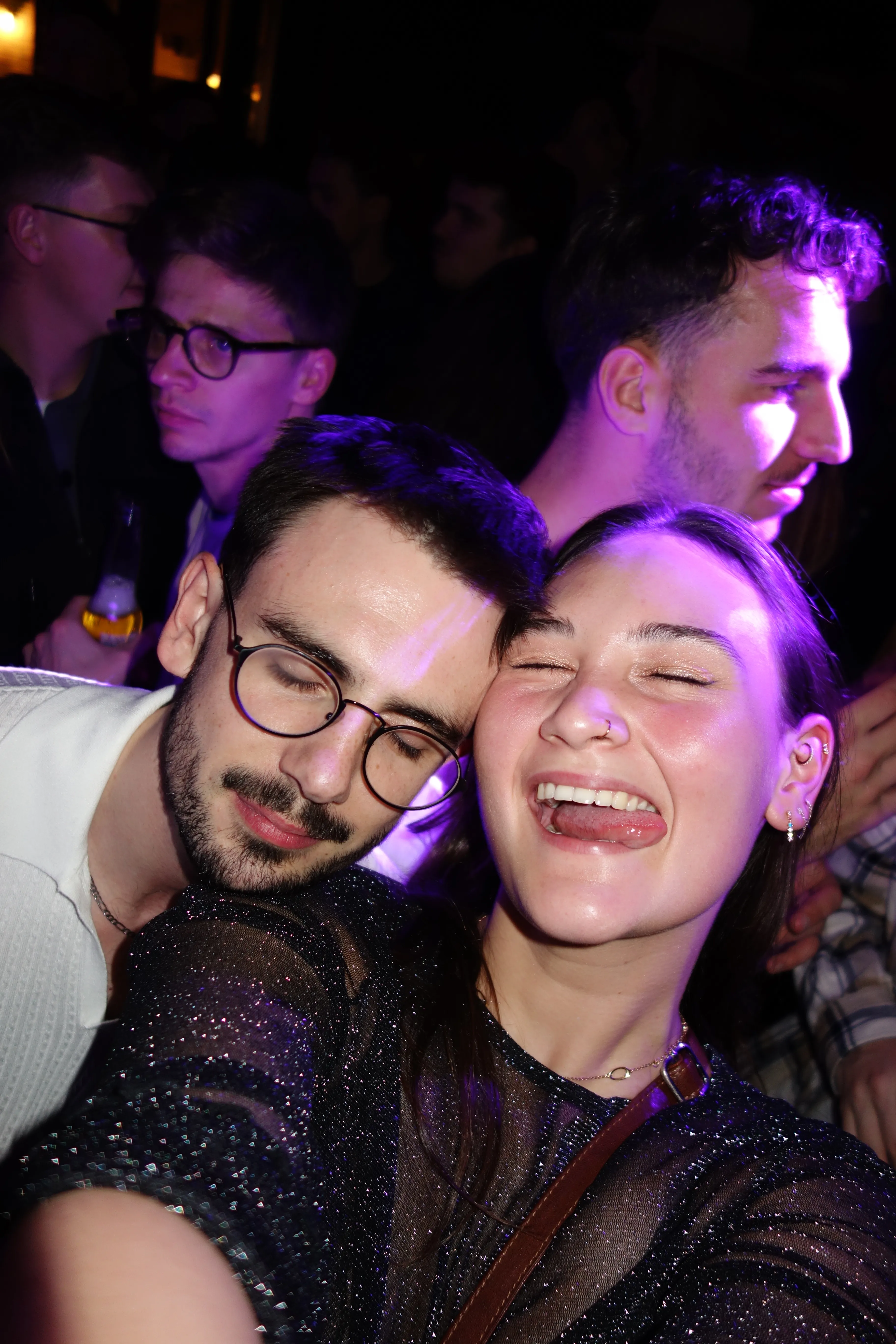 A bird sitting on a nest of eggs.