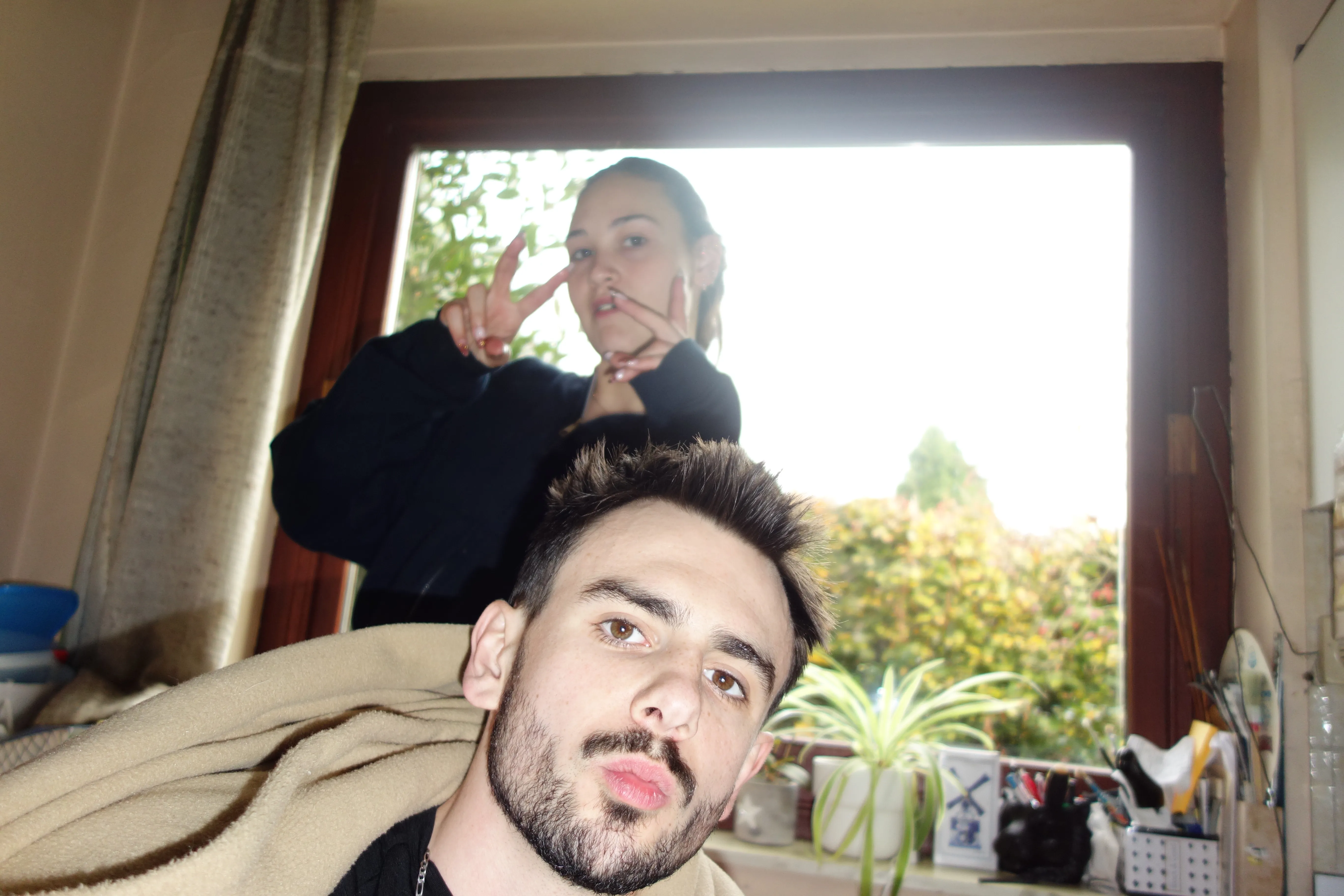 A bird sitting on a nest of eggs.